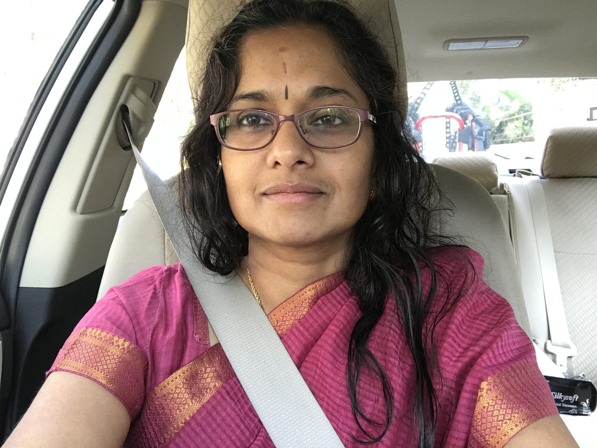 Jayanthi in a sari, selfie in the car