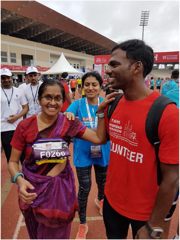 Jayanthi with her coach Vignan after the race